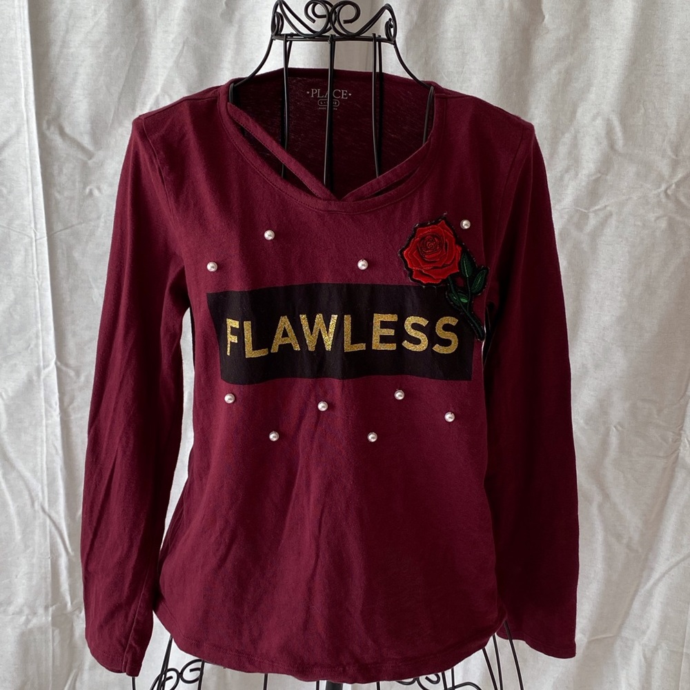 Girl’s long sleeve shirt.